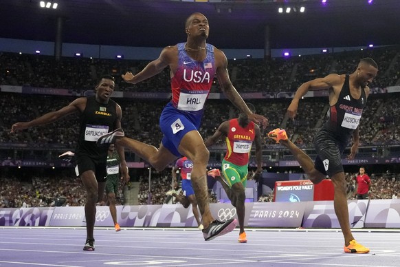 Quincy Hall, left, of the United States, beats Matthew Hudson-Smith, of Britain, to win the men&#039;s 400-meter final at the 2024 Summer Olympics, Wednesday, Aug. 7, 2024, in Saint-Denis, France. (AP ...