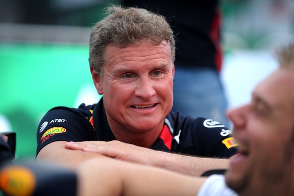 epa07518058 Former British Formula One driver David Coulthard (L) talks to Dutch DJ Armin van Buuren (R) before an event in Hanoi, Vietnam, 20 April 2019. The Formula One Vietnam Grand Prix kick-off e ...