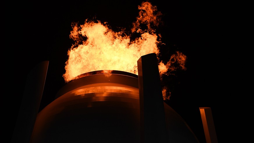 epa06509200 The Olympic Flame i the cauldron during the Opening Ceremony of the PyeongChang 2018 Olympic Games at the Olympic Stadium, Pyeongchang county, South Korea, 09 February 2018. EPA/CHRISTIAN  ...