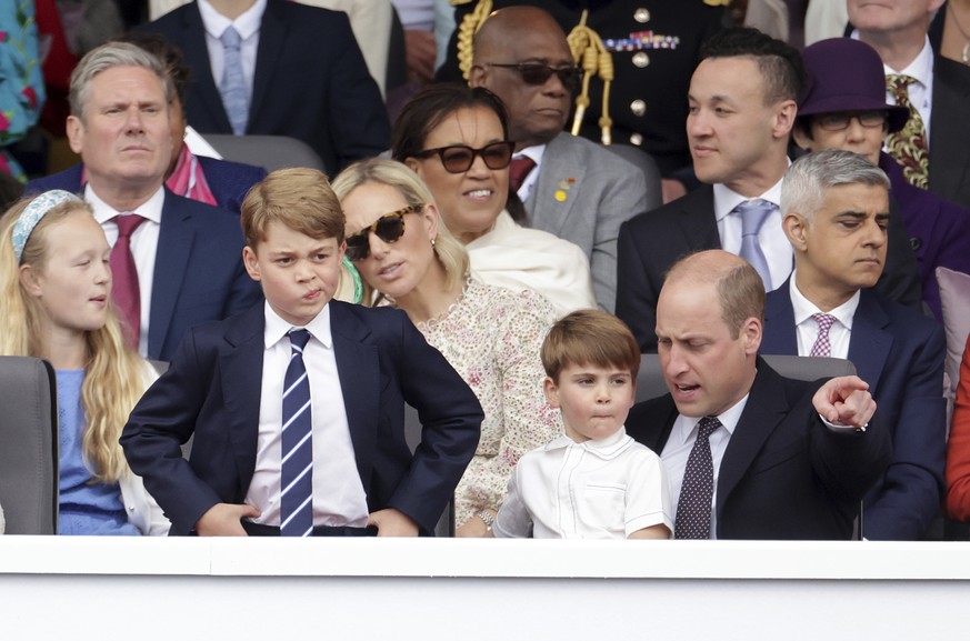 Prince George, Prince Louis and Prince William watch the Platinum Jubilee Pageant outside Buckingham Palace in London, Sunday June 5, 2022, on the last of four days of celebrations to mark the Platinu ...