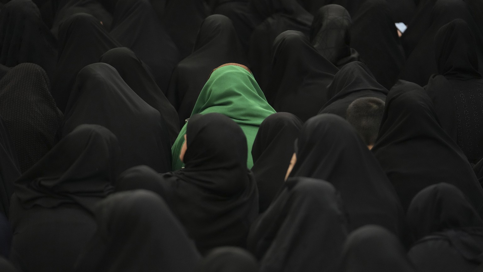 Women attend the Ashoura mourning ritual, Friday, July 28, 2023, in Tehran, Iran. Millions of Shiite Muslims around the world on Friday commemorated Ashoura, a remembrance of the 7th-century martyrdom ...