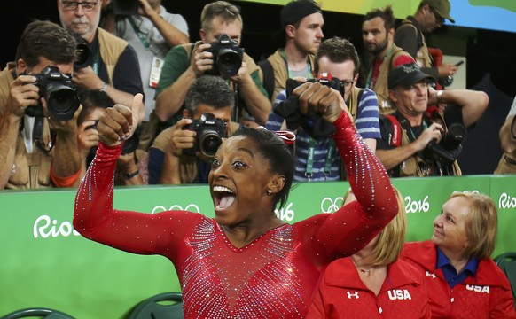 2016 Rio Olympics - Artistic Gymnastics - Final - Women&#039;s Vault Final - Rio Olympic Arena - Rio de Janeiro, Brazil - 14/08/2016. Simone Biles (USA) of USA celebrates winning the gold in the women ...