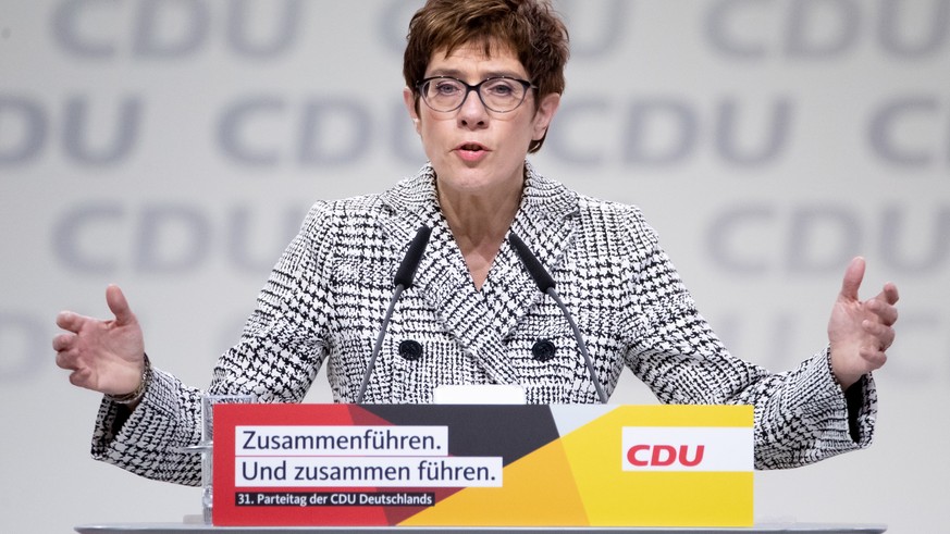 epa07214745 The candidate for the leadership of the German Christian Democratic Union (CDU), Annegret Kramp-Karrenbauer, holds her application speech during the 31st Party Congress of the Christian De ...