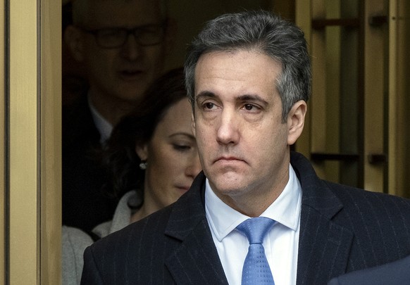 FILE - In this Dec. 12, 2018 file photo, Michael Cohen, President Donald Trump&#039;s former lawyer, leaves federal court after his sentencing in New York. A judge has agreed to postpone the start of  ...