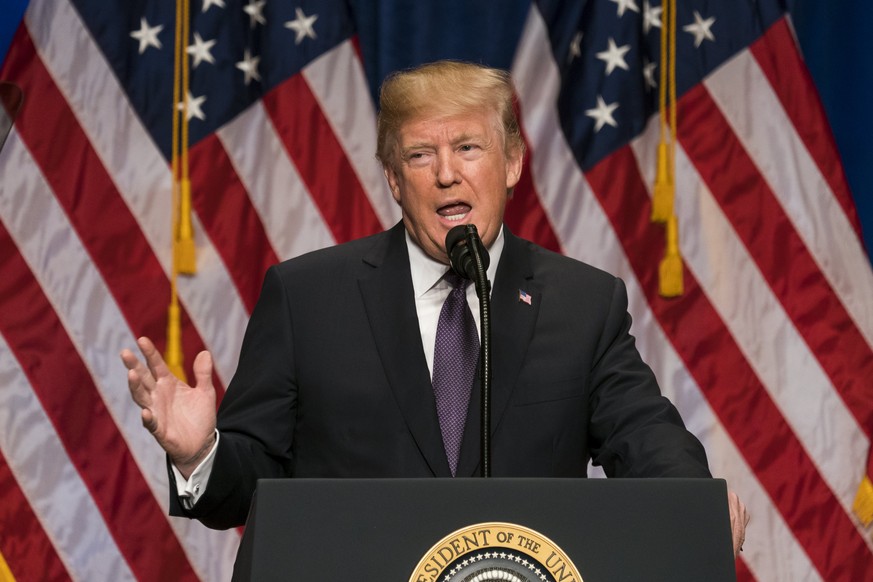 epa06397679 US President Donald J. Trump speaks on his &#039;America First&#039; national security strategy in the Ronald Reagan Building and International Trade Center in Washington, DC, USA 18 Decem ...