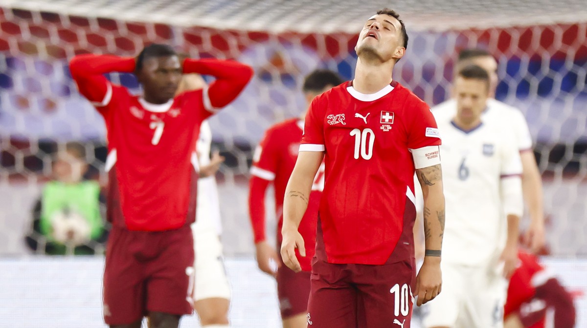 Switzerland's midfielder Granit Xhaka, center, reacts next to forward Breel Embolo, left, during the UEFA Nations League soccer match between Switzerland and Serbia at the Letzigrund stadium in Z ...