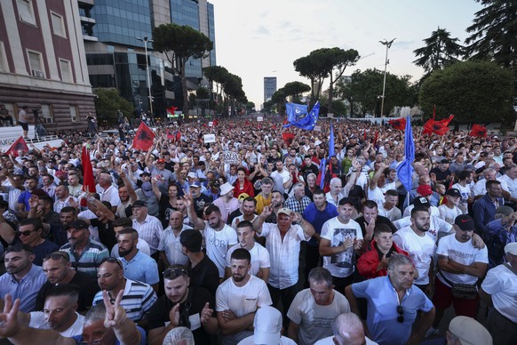 Protesters gather outside the Prime Minister's office during an anti-government rally in Tirana, Albania, on Thursday, July 7, 2022. The Albanian opposition rallied Thursday in the capital Tirana ...