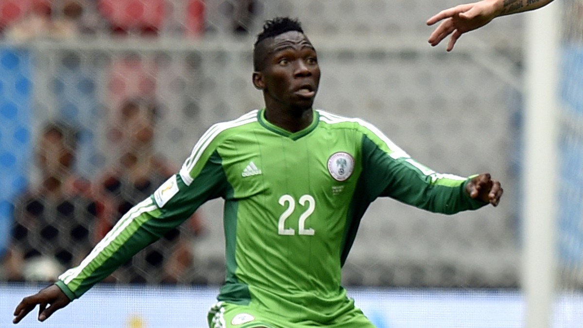 France's Olivier Giroud, right, gets above Nigeria's Kenneth Omeruo during the World Cup round of 16 soccer match between France and Nigeria at the Estadio Nacional in Brasilia, Brazil, Mond ...