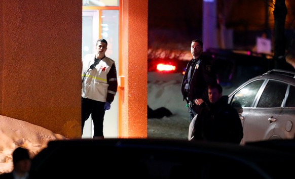 First responders look on after a shooting at a mosque in Quebec City, January 29, 2017. REUTERS/Mathieu Belanger