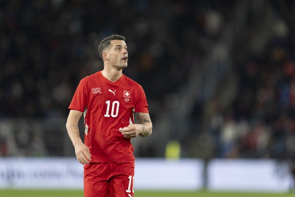 Switzerland's Granit Xhaka reacts at the end of the first half during a friendly soccer match between Switzerland and Germany at the St. Jakob-Park stadium in Basel, Switzerland, on Friday, March ...