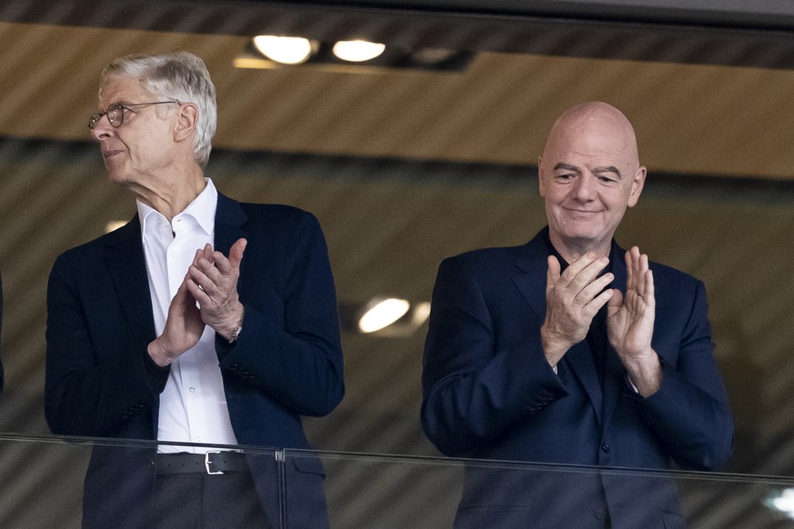 FIFA president Gianni Infantino, right, and Arsene Wenger, Chief Officer (FIFA) and former soccer, left, applaud prior to the UEFA Women's EURO 2025 quarterfinals soccer match between Sweden and  ...