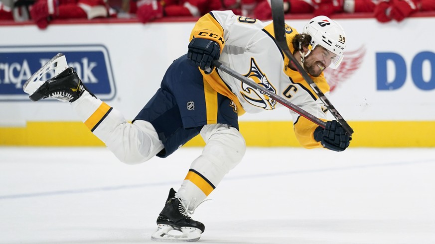 Nashville Predators defenseman Roman Josi breaks his stick on a shot against the Detroit Red Wings in the first period of an NHL hockey game Tuesday, Feb. 23, 2021, in Detroit. (AP Photo/Paul Sancya)