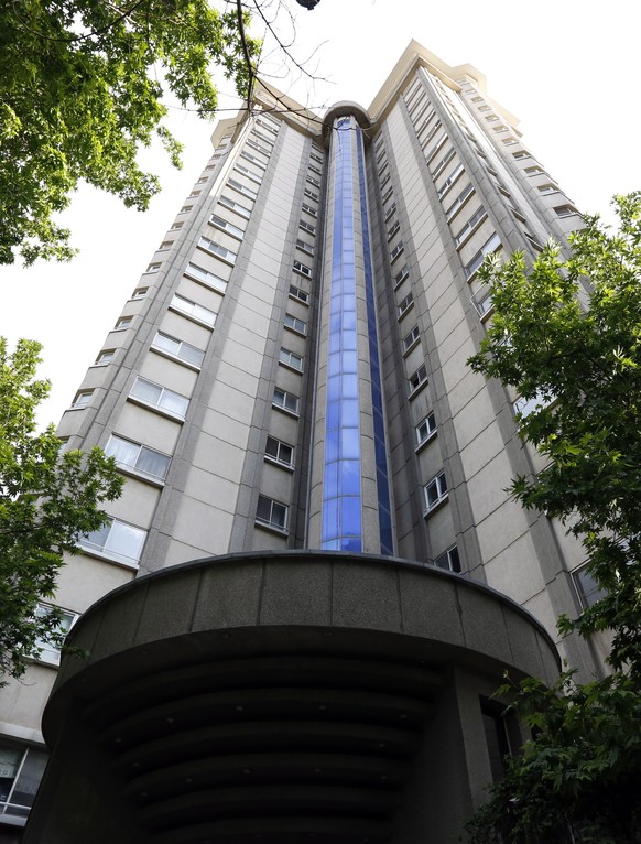 epa09177494 Exterior view of the high-riser where a Swiss embassy staff was resident, in the Kamranieh neighbourhood in Tehran, Iran, 04 May 2021. According to the emergency service spokesman, a senio ...