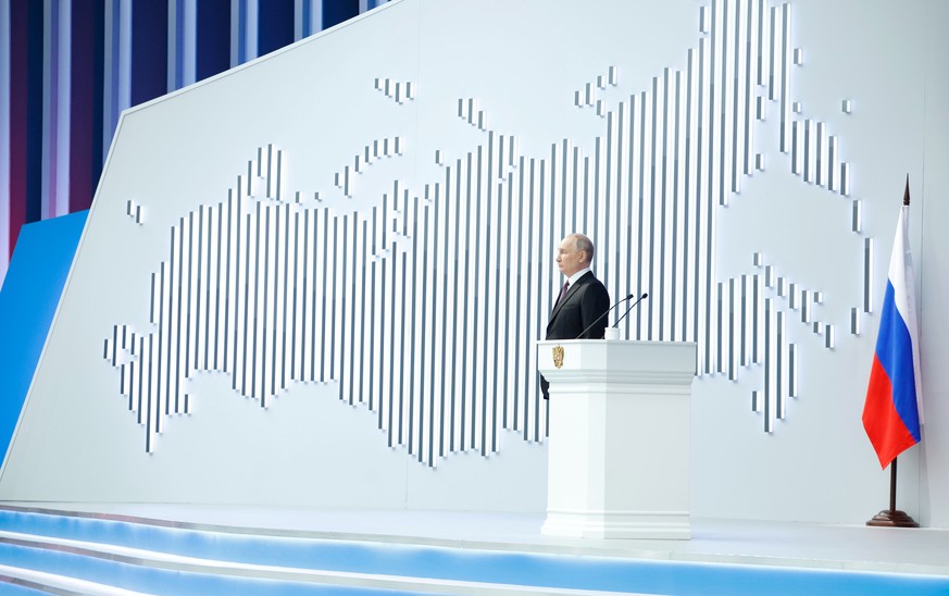 epa11188457 Russian President Vladimir Putin delivers his annual speech to the Federal Assembly at the Gostiny Dvor conference center in Moscow, Russia, February 29, 2024. About 1,200 people, including…