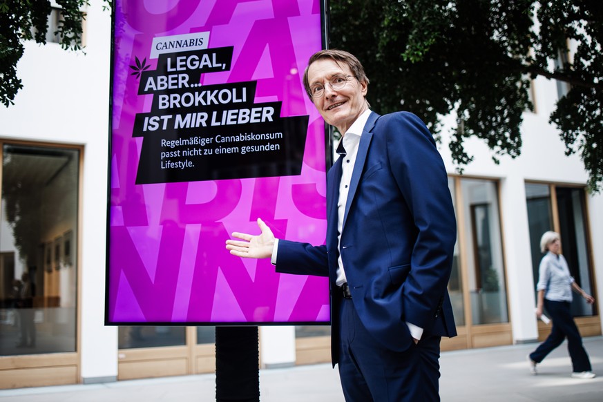 epa10802798 German Health Minister Karl Lauterbach poses in front of a display reading &#039;Cannabis. Legal, but... I prefer broccoli. Regular cannabis use does not fit into a healthy lifestyle.&#039 ...