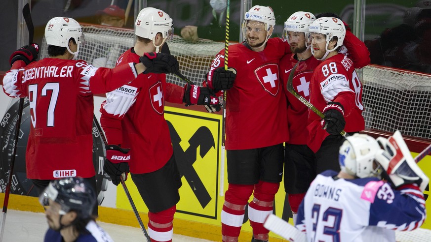 Switzerland&#039;s forward Christoph Bertschy, right, celebrates his goal with teammates defender Jonas Siegenthaler, left, defender Mirco Mueller, 2n d left, forward Noah Rod, center, and forward Tri ...