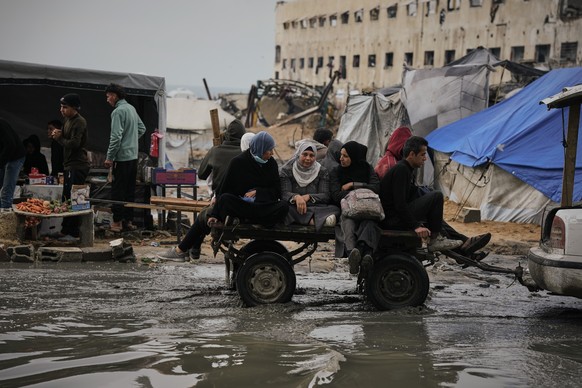 Palestinians ride in a cart pulled by a vehicle through a flooded street after stormy weather in Gaza City Wednesday, Dec. 10, 2025. (AP Photo/Jehad Alshrafi)
APTOPIX Israel Palestinians Gaza