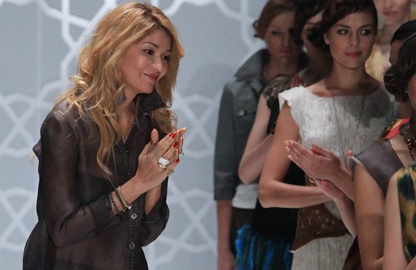 epa04121712 (FILE) A file photo dated 02 April 2011 showing Gulnara Karimova (L), daughter of Uzbek President Uzbek President Islam Karimov, after showing her brand GULI at the Mercedes-Benz Fashion W ...