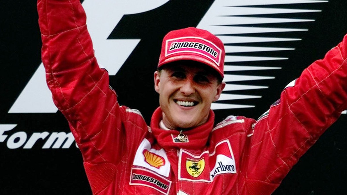 Germany's Michael Schumacher holds aloft the trophy for winning the Malaysian Grand Prix on Sunday October 22, 2000. Schumacher's victory ensured his Ferrari team their tenth Constructors  ...