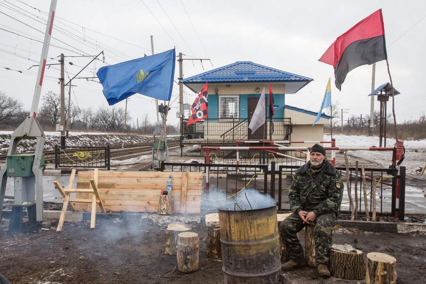 epa05806316 A photograph made available on 21 February shows Ukrainian activists blocking a railway line in Shcherbynivka village near Toretsk, Donetsk area, Ukraine, 20 February 2017. Ukrainian activ ...