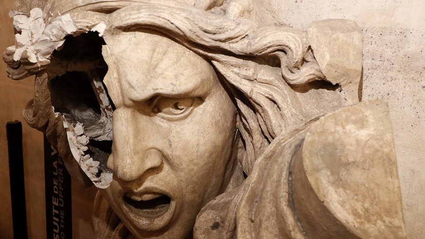 epaselect epa07202576 A vandalizes statue of the Marianne, a symbol in France, seen inside the Arc de Triomphe, as protesters wearing yellow vests (gilets jaunes) entered the Arc de Triomphe monument  ...