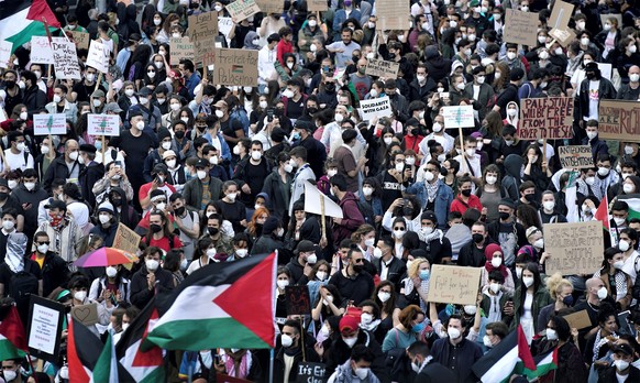 People attend a protest rally in solidarity with Palestinians in Berlin, Germany, Saturday, May 15, 2021. (AP Photo/Michael Sohn)