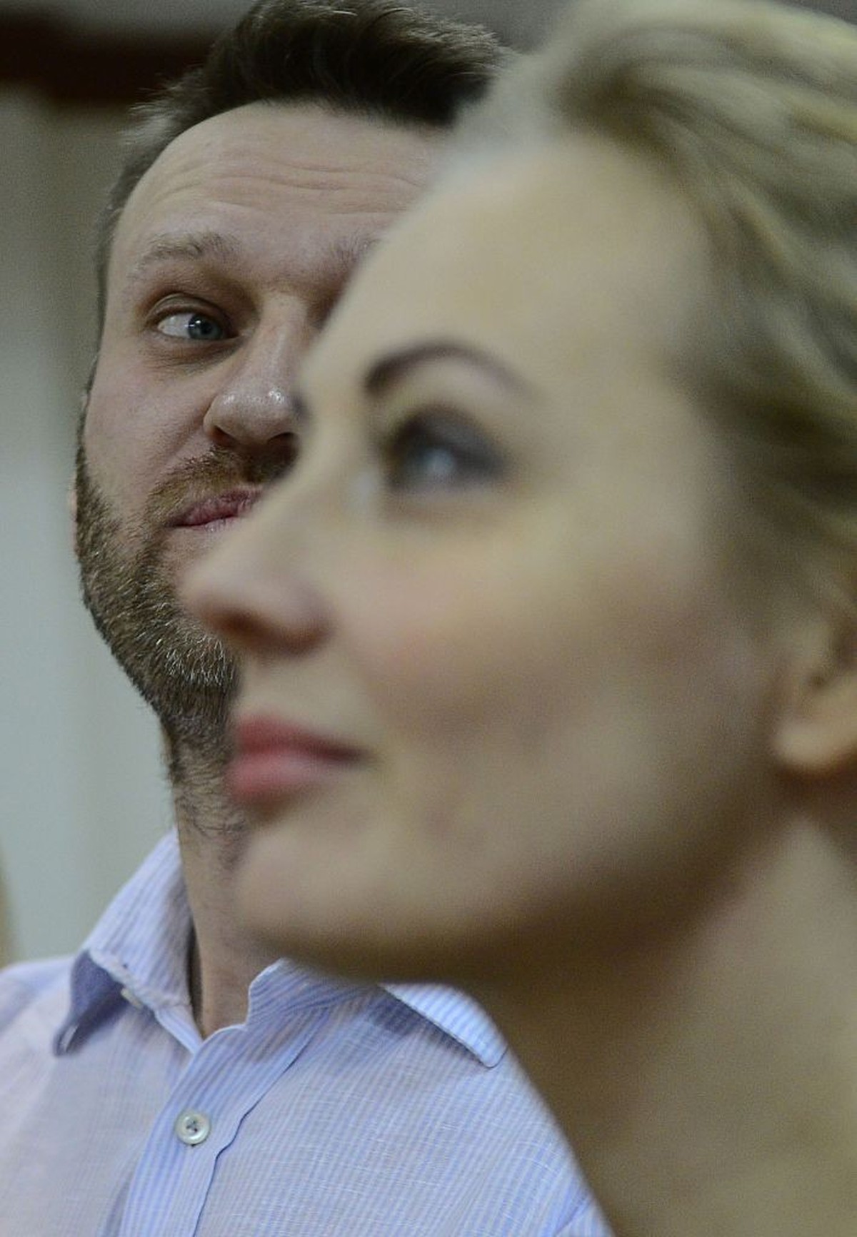 MOSCOW, RUSSIA - FEBRUARY 17: Russian anti-Kremlin opposition leader Alexei Navalny (L) accompanied his wife Yulia Navalny (R) attend the action of objection verdict announcement of their fraud trial  ...