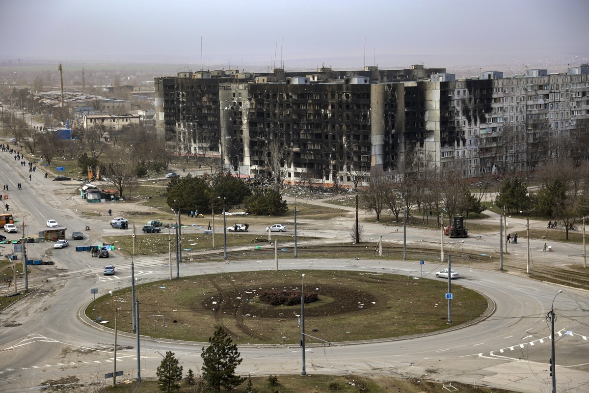 FILE - Damage is seen on apartment buildings after shelling from fighting on the outskirts of Mariupol, Ukraine, in territory under control of the separatist government of the Donetsk People's Re ...