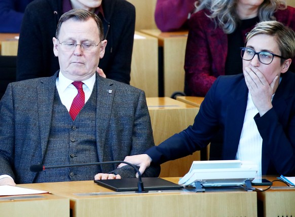 epa08195346 Former Prime Minister of Thuringia state Bodo Ramelow (L), with Die Linke chairman faction Susanne Hennig-Wellsow (R) during Thuringia state regional elections in Erfurt, Germany, 05 Febru ...