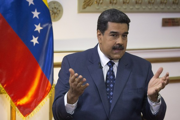 Venezuela&#039;s President Nicolas Maduro speaks during an interview with The Associated Press at Miraflores presidential palace in Caracas, Venezuela, Thursday, Feb. 14, 2019. Even while criticizing  ...