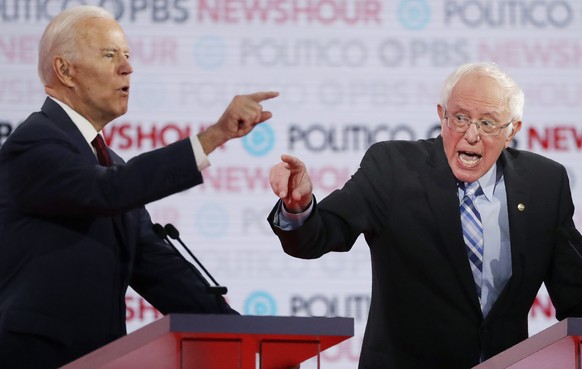 Democratic presidential candidates former Vice President Joe Biden, left, and Sen. Bernie Sanders, I-Vt., speak during a Democratic presidential primary debate Thursday, Dec. 19, 2019, in Los Angeles. ...