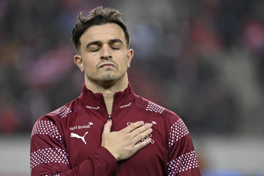 Switzerland&#039;s midfielder Xherdan Shaqiri sings the national anthem before the 2022 FIFA World Cup European Qualifying Group C match between Switzerland and Bulgaria at the Swissporarena stadium i ...