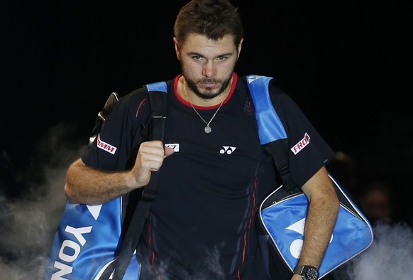 Stanislas Wawrinka of Switzerland arrives at the court to face Novak Djokovic of Serbia during their ATP World Tour Finals single semifinal tennis match at the O2 Arena in London Sunday, Nov. 10, 2013 ...