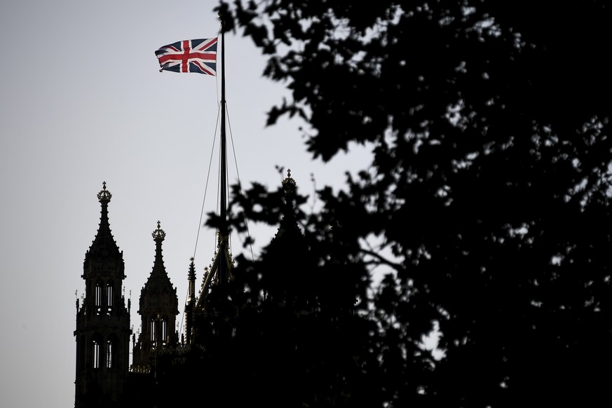 The Union Flag flies over the Victoria Tower, Houses of Parliament, in London, Friday, Oct. 18, 2019. Britain&#039;s Parliament is set to vote Saturday on Prime Minister Boris Johnson&#039;s new deal  ...