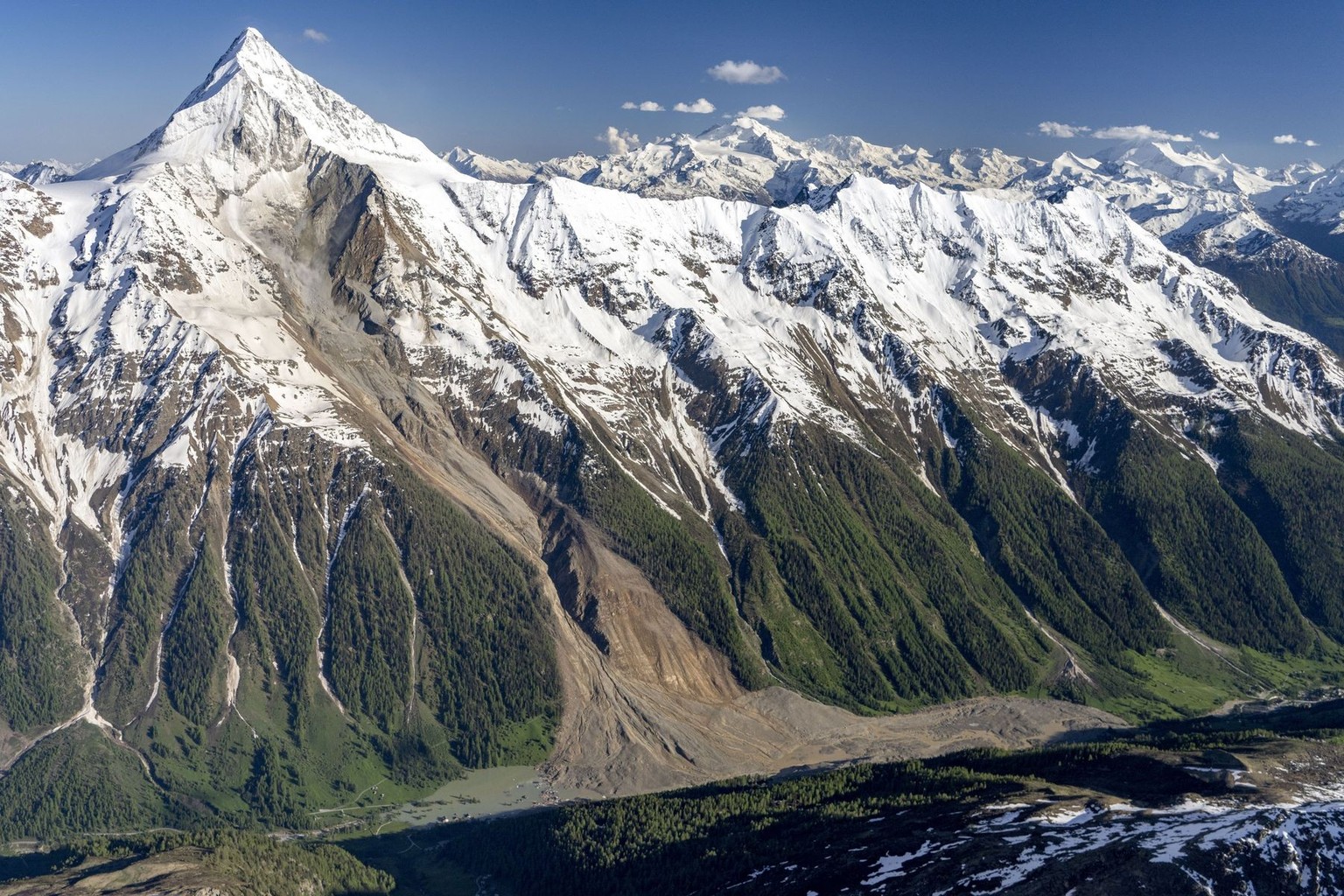 A aerial view captured after a massive avalanche, triggered by the collapse of the Birch Glacier, shows the destruction it caused as it swept down to the valley floor and demolishing the village of Bl ...