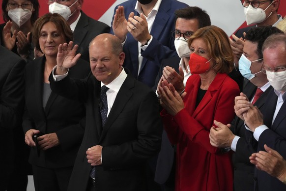 Olaf Scholz, Finance Minister and SPD candidate for Chancellor waves to his supporters after German parliament election at the Social Democratic Party, SPD, headquarters in Berlin, Sunday, Sept. 26, 2 ...