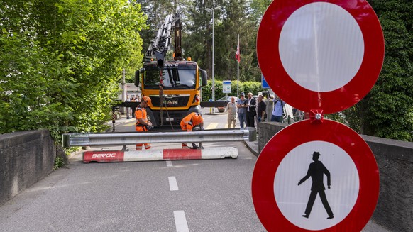 epa13030999 Workers place concrete barriers on a street to block access to the Hermance customs post, near Geneva, Switzerland, 11 June 2026, at the Franco-Swiss border during the G7 summit in nearby  ...