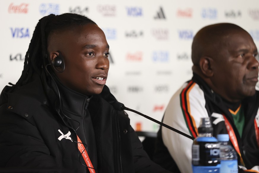 Zambia&#039;s Barbra Banda, left, and head coach Bruce Mwape answer questions during a press conference Friday, July 21, 2023 in Hamilton, New Zealand, ahead of opening match and Women&#039;s World Cu ...