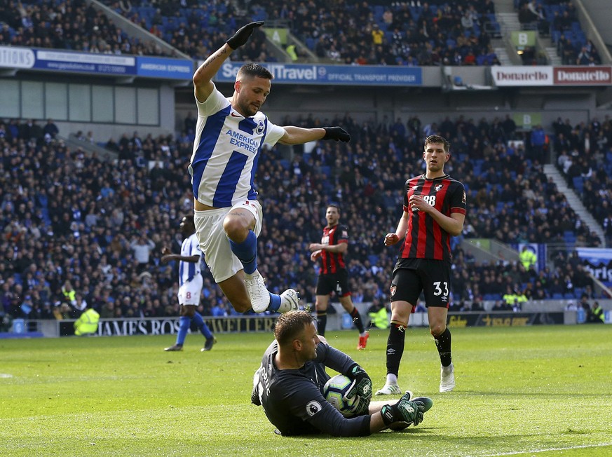 Bournemouth goalkeeper Artur Boruc saves from Brighton & Hove Albion's Florin Andone during their English Premier League soccer match at the AMEX Stadium, Brighton, England, Saturday, April 1 ...