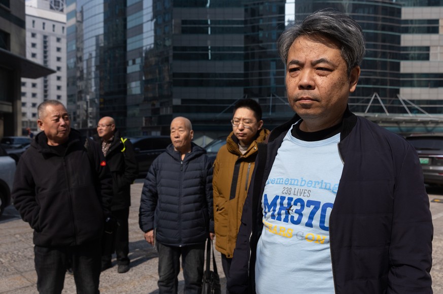 epa11948247 Jiang Hui, who lost his mother on Malaysia Airlines flight MH 370, speaks to the media as he gathers with others who also lost family members on the flight to commemorate the 11th annivers ...