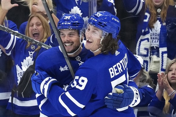 Toronto Maple Leafs&#039; Tyler Bertuzzi, right, celebrates with Auston Matthews after scoring against the Detroit Red Wings during the second period of an NHL hockey preseason game Thursday, Oct. 5,  ...