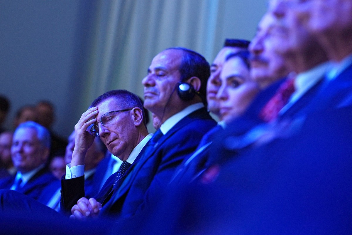 Latvia's President Edgars Rinkevics, center left, listsns to the address of President Donald Trump during the Annual Meeting of the World Economic Forum in Davos, Switzerland, Wednesday, Jan. 21, ...