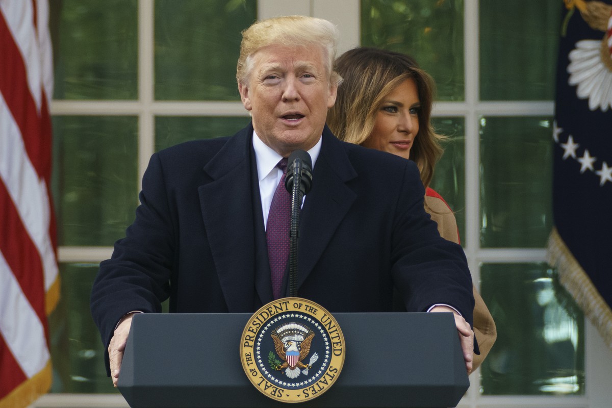 President Donald Trump and first lady Melania Trump arrive for a ceremony to pardon the National Thanksgiving Turkey in the Rose Garden of the White House in Washington, Tuesday, Nov. 20, 2018. (AP Ph ...