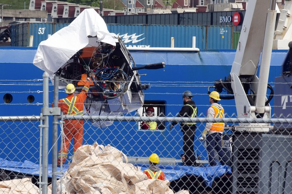 Debris from the submarine Titan, salvaged from the ocean floor near the wreckage of the Titanic, is unloaded from the ship Horizon Arctic at the Canadian Coast Guard pier in St. John's, Newfoundl...