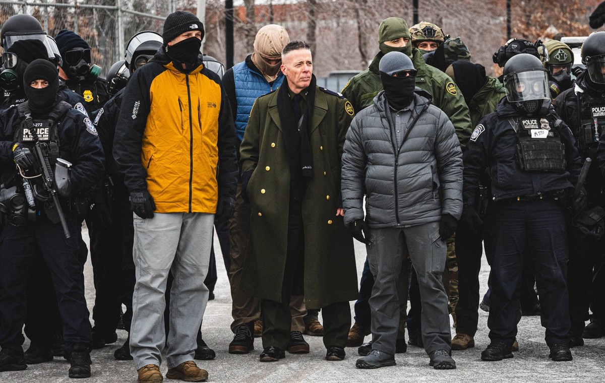 January 15, 2026, Minneapolis, Minnesota, USA: Border Chief GREGORY BOVINO observes a protest as community members gather at the entrance of the Whipple Building in Minneapolis to rally in solidarity  ...