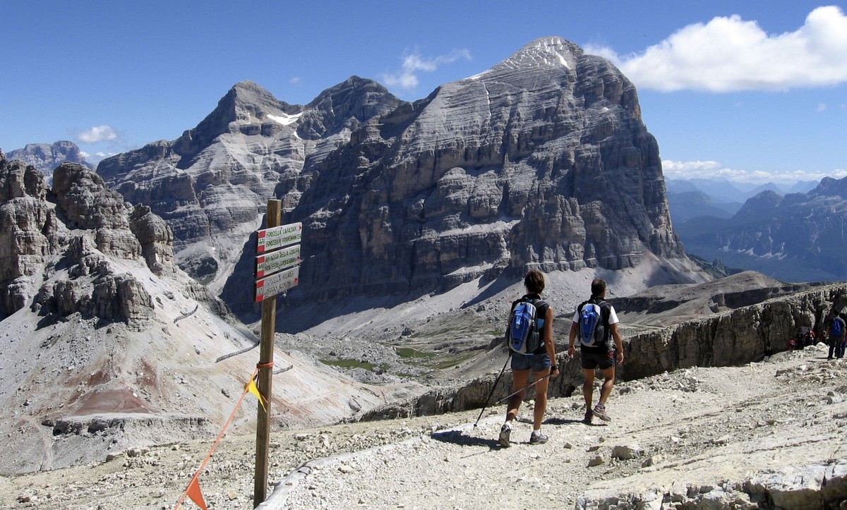 This 2010 photo courtesy of Giovanna Dell'Orto shows hikers as they start on the steep descending trail from the Rifugio Lagazuoi, which at 9,000 feet towers above some of the most striking peaks ...