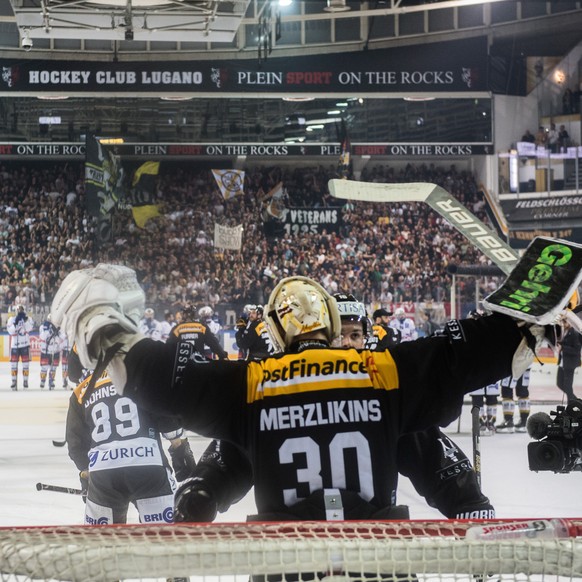 Lugano&#039;s goalkeeper Elvis Merzlikins celebrates the victory after the fifth match of the playoff final of the National League of the ice hockey Swiss Championship between the HC Lugano and the ZS ...