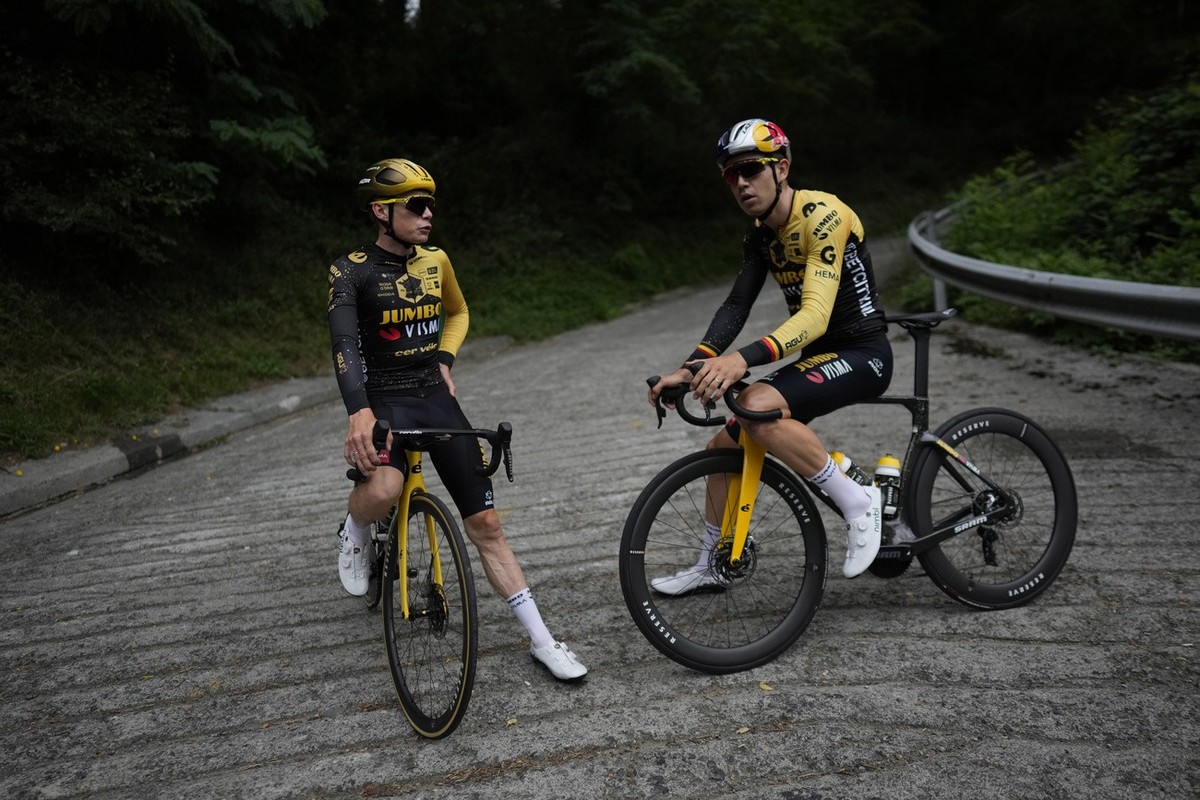 Denmark's Jonas Vingegaard, left, and Belgium's Wout Van Aert take a break during a training near Bilbao, Spain, Thursday, June 29, 2023. The Tour de France cycling race starts on Saturday,  ...