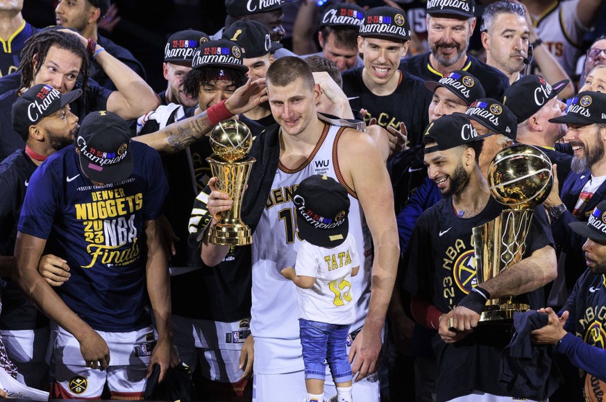 June 12, 2023, Denver, Colorado, USA: NIKOLA JOKIC of the Denver Nuggets is presented with the Bill Russell Finals MVP Trophy after winning Game 5 of the 2023 NBA, Basketball Herren, USA Finals game a ...
