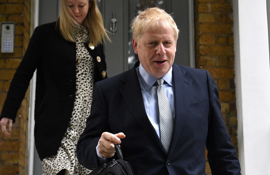 epa07644877 Conservative leadership candidate Boris Johnson (R) leaves his home in central London, Britain, 13 June 2019. Conservative MPs will begin the process of choosing their new leader and the n ...